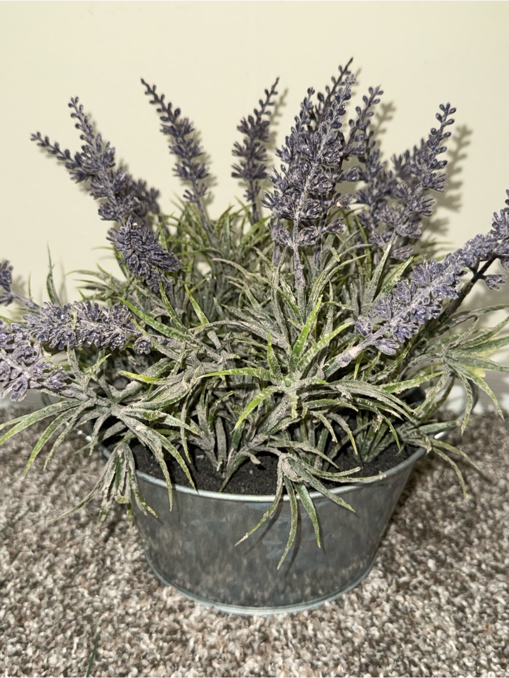 Artificial lavender plant in silver bucket